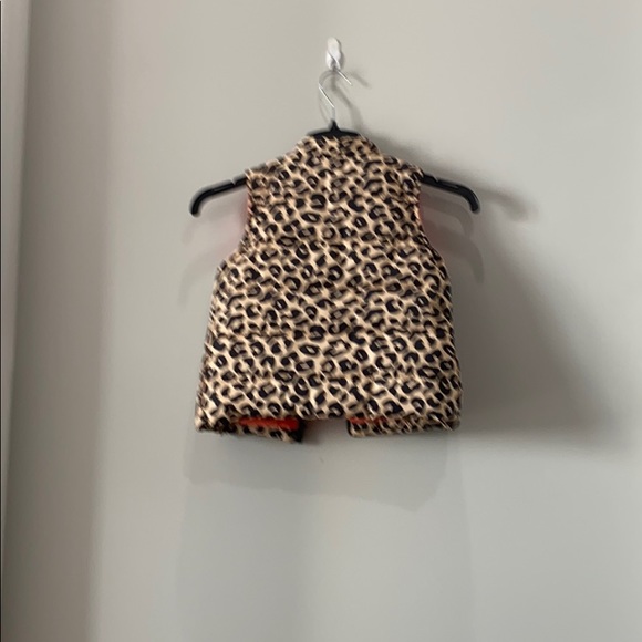 It is a cheetah vest it is Black and Tan - Picture 2 of 4